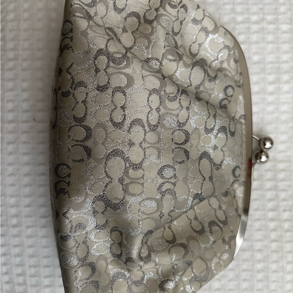 Authentic Coach signature canvas wristlet in silver/gold.